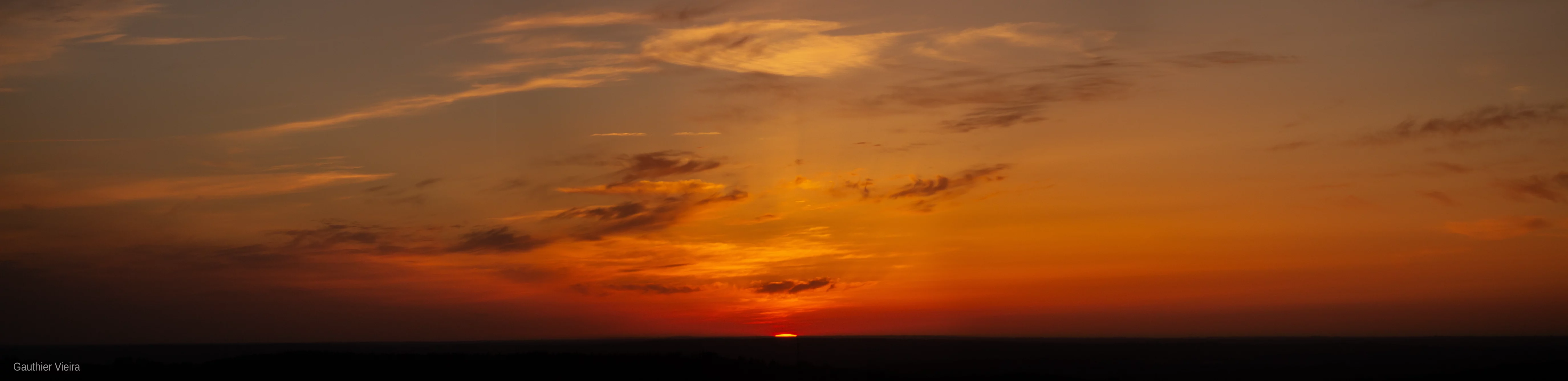 Photographie d'un coucher de soleil à Saint-Michel-de-Braspart